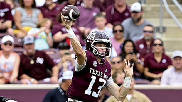 Texas A&M QB Haynes King throws a pass against Sam Houston State.